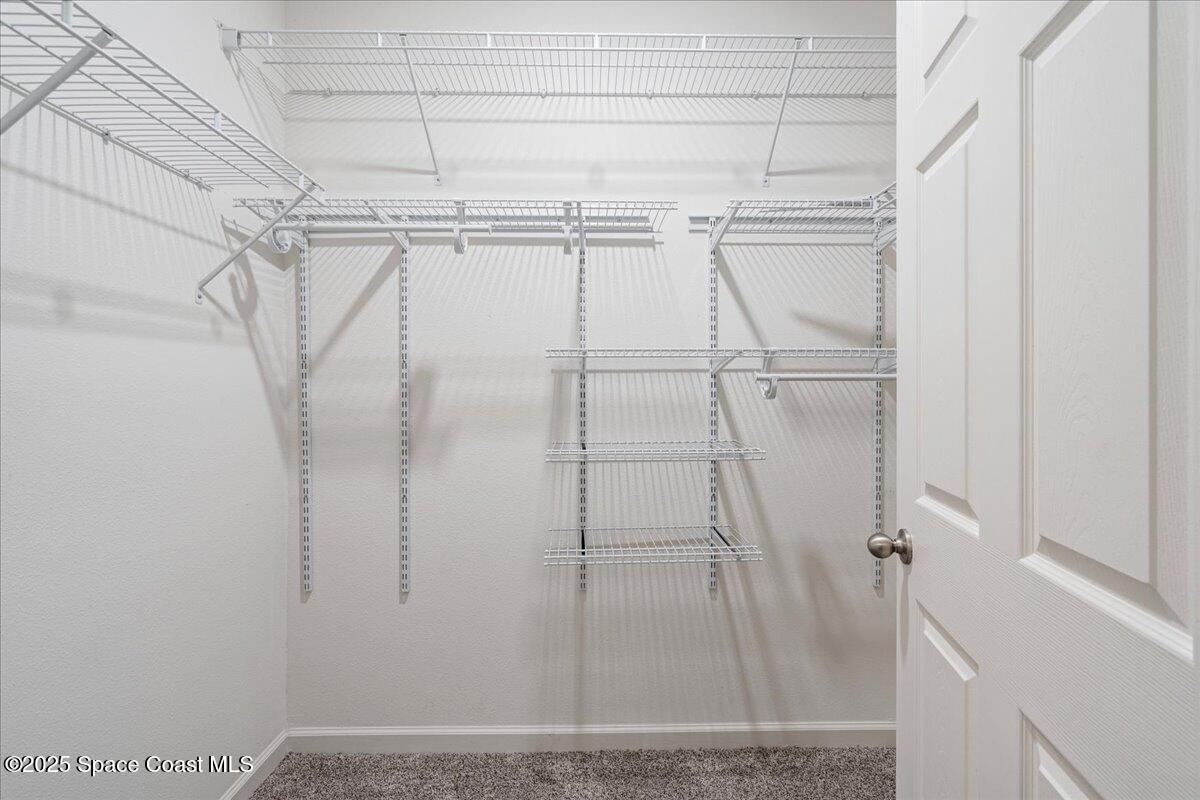 1120 Swiss Pointe Lane Rockledge, FL 32955 - Photo 19 of 47 a view of a room with racks on the wall