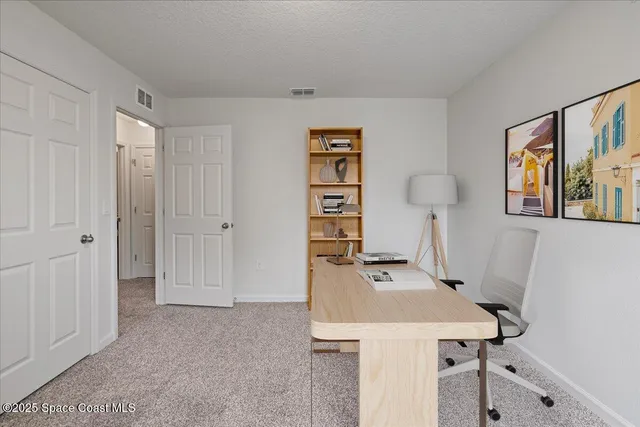 a workspace with furniture and window