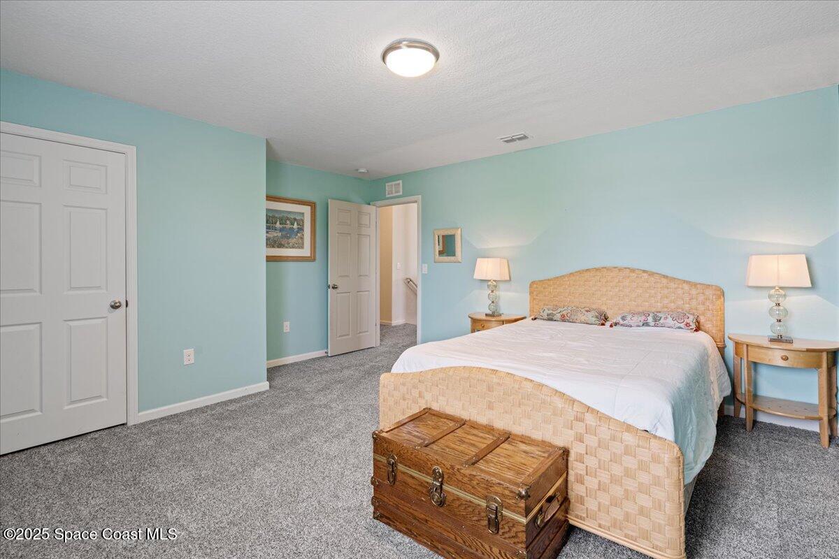 1120 Swiss Pointe Lane Rockledge, FL 32955 - Photo 26 of 47 a bedroom with a bed and closet