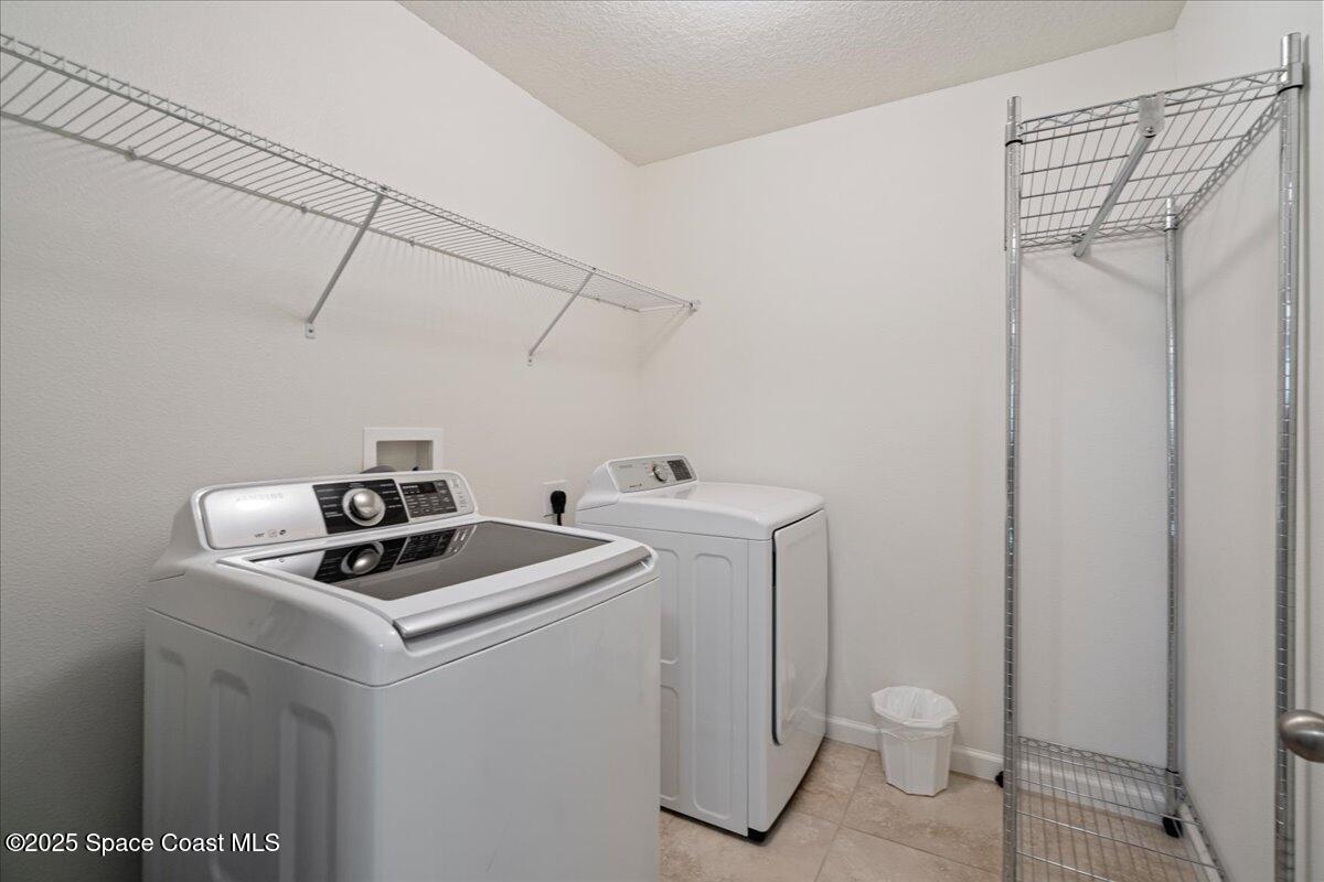 1120 Swiss Pointe Lane Rockledge, FL 32955 - Photo 29 of 47 a utility room with dryer and washer