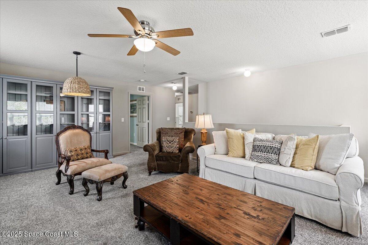 1120 Swiss Pointe Lane Rockledge, FL 32955 - Photo 30 of 47 a living room with furniture