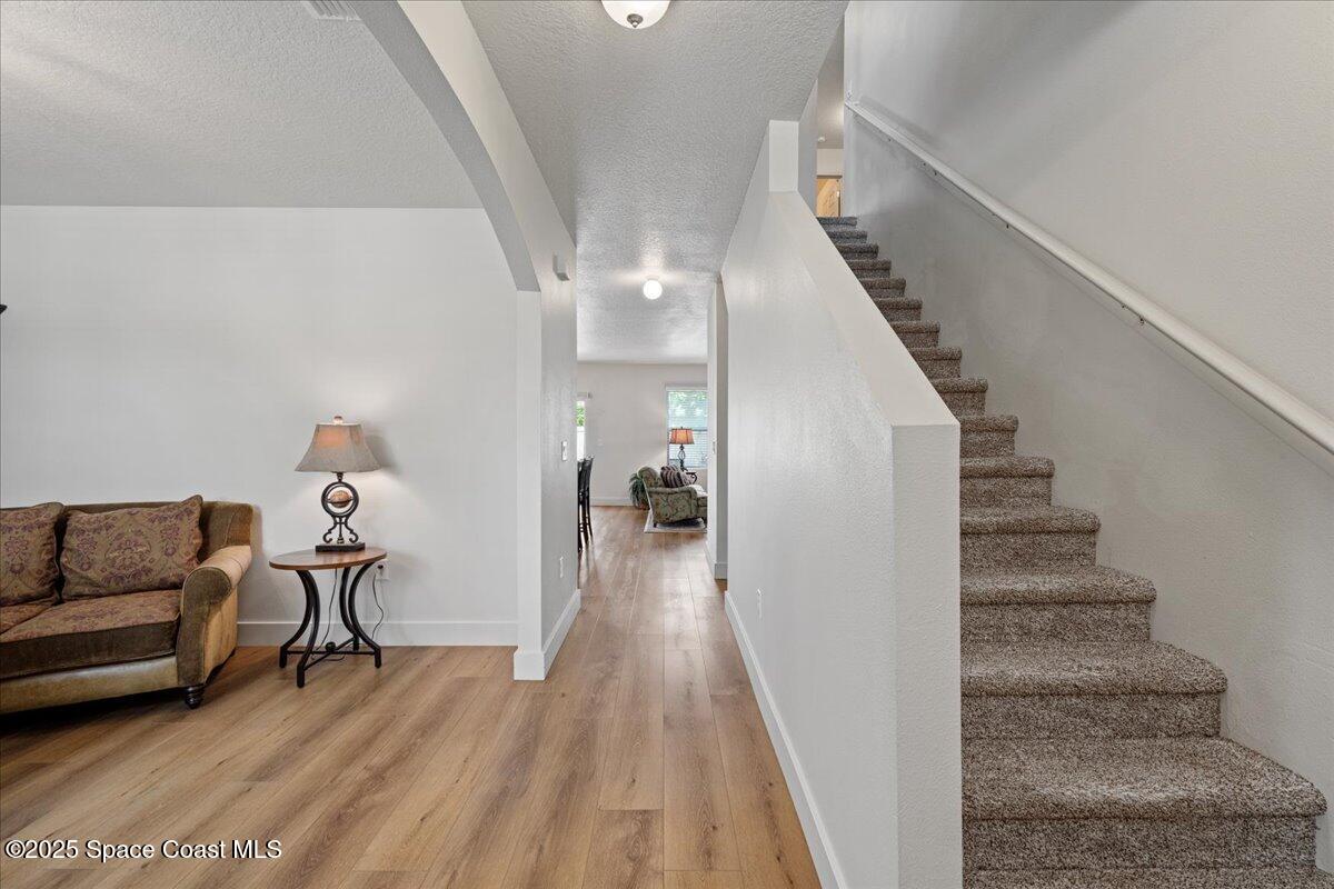 1120 Swiss Pointe Lane Rockledge, FL 32955 - Photo 3 of 47 a view of entryway and hall with wooden floor