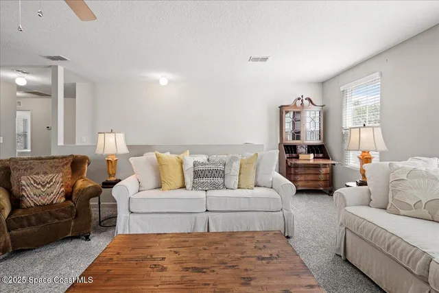 a living room with furniture and a couch