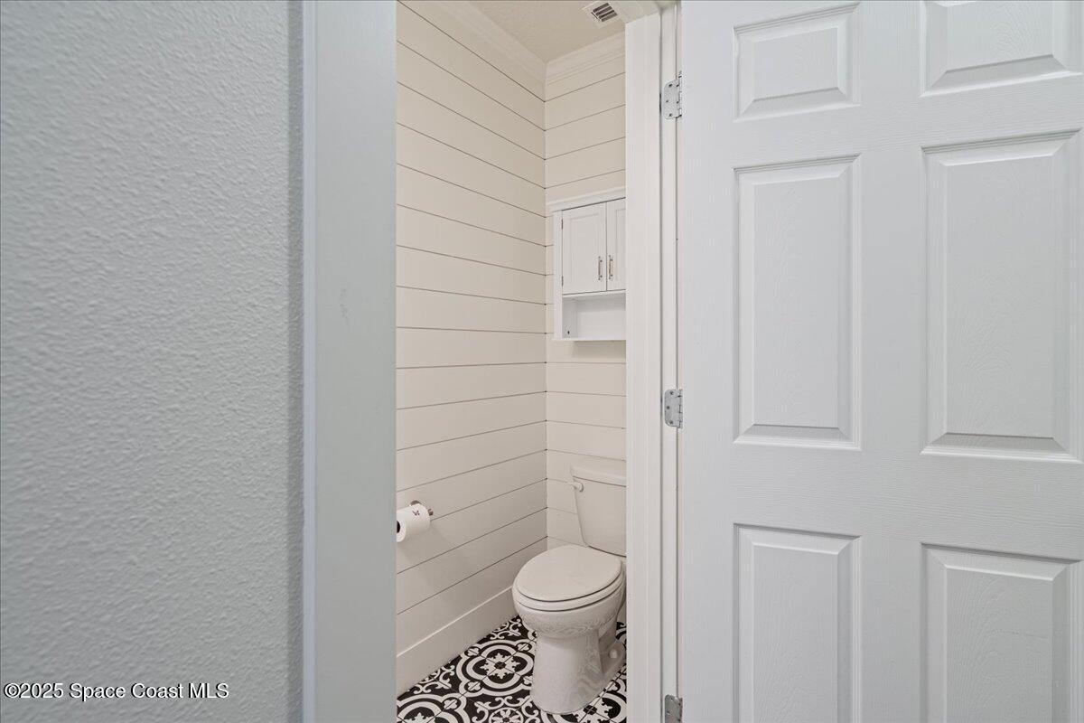 1120 Swiss Pointe Lane Rockledge, FL 32955 - Photo 37 of 47 a bathroom with a toilet