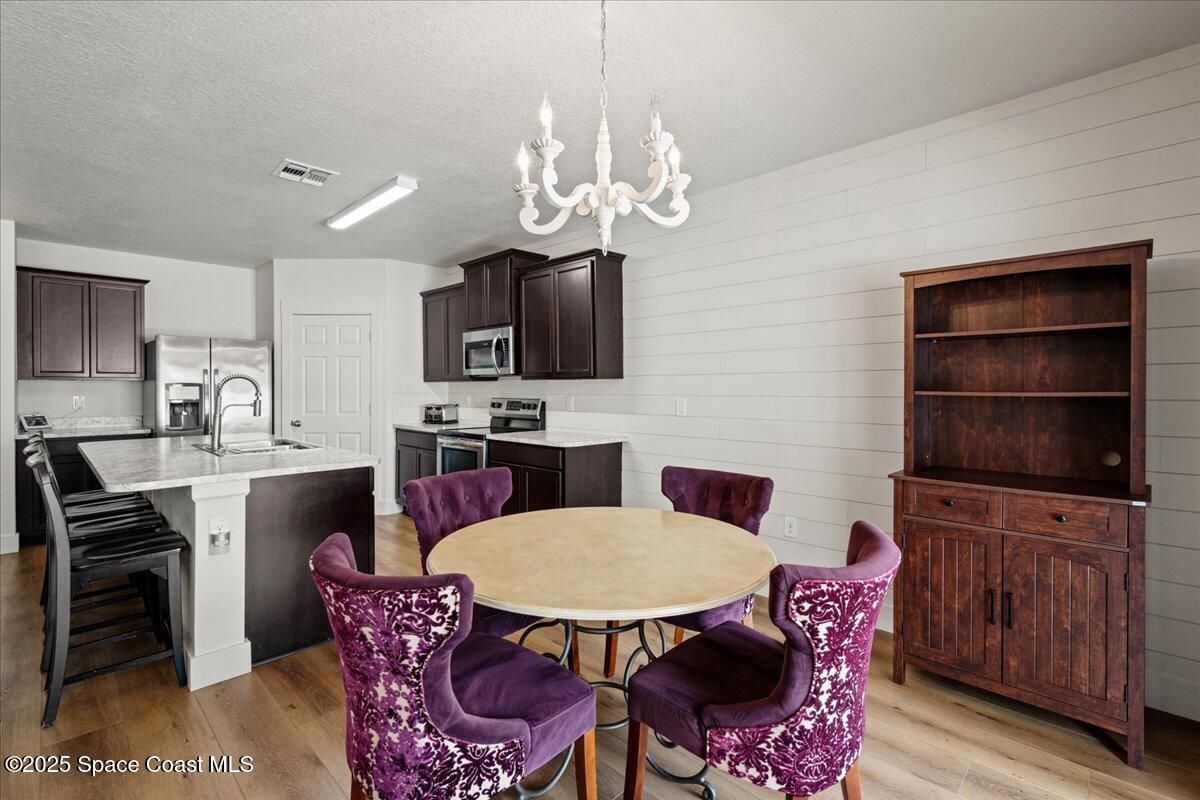 1120 Swiss Pointe Lane Rockledge, FL 32955 - Photo 8 of 47 a view of a dining room with furniture