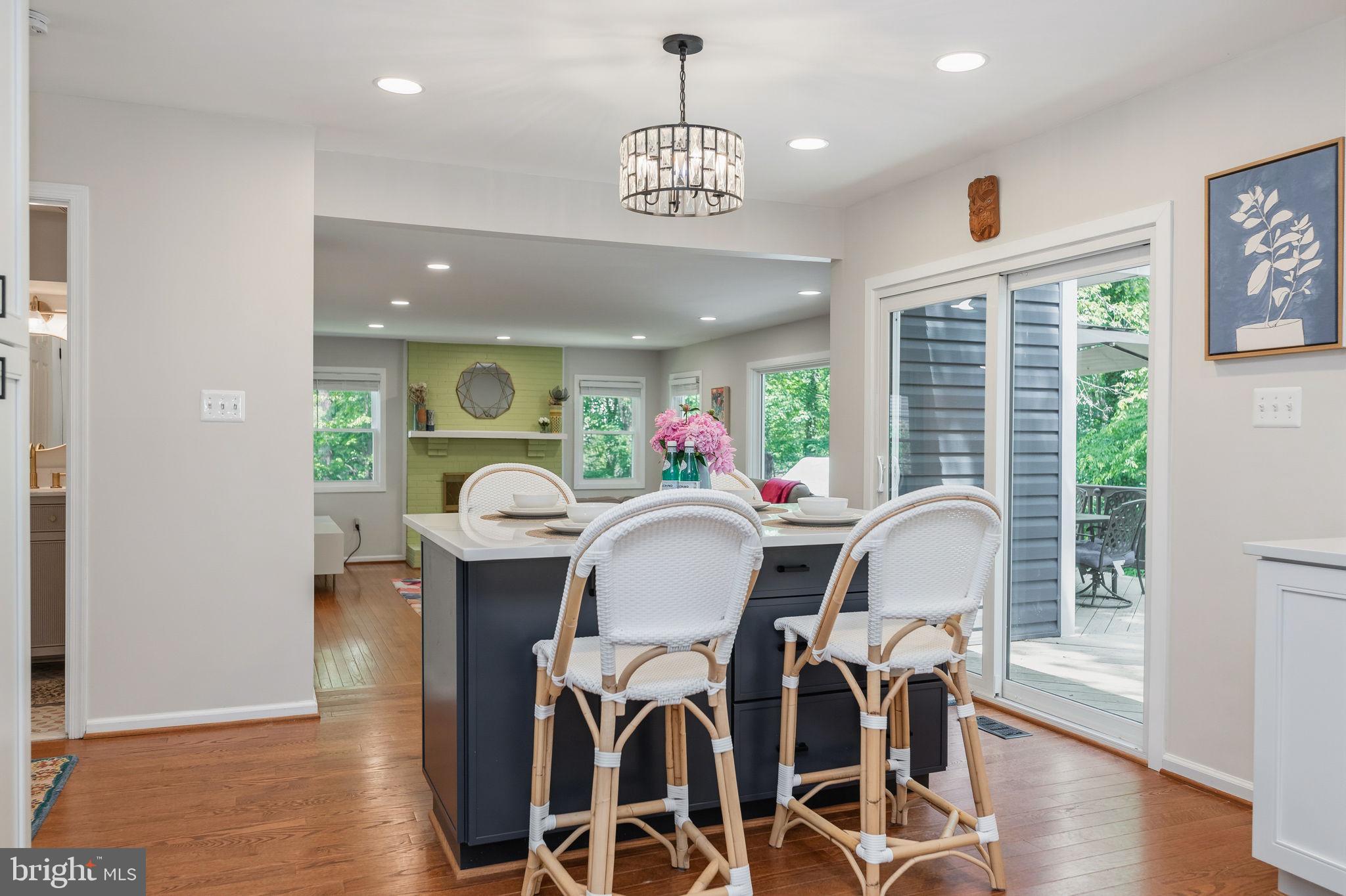 7603 Modisto Lane Springfield, VA 22153 - Photo 16 of 57 a view of a dining room with furniture window and wooden floor
