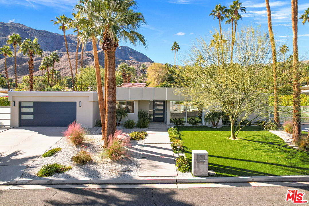 71581 Halgar Road Rancho Mirage, CA 92270 - Photo 3 of 46 a front view of a house with garden