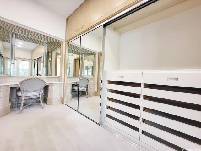 a view of living room kitchen and entryway