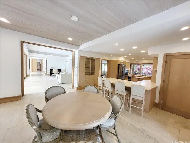 a view of kitchen with dining table and chairs