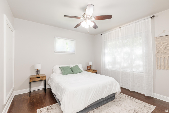 227 West 200 North Logan, UT 84321 - Photo 20 of 44 Spacious room featuring rich wood-finish flooring, light neutral walls, and a ceiling fan with integrated lighting