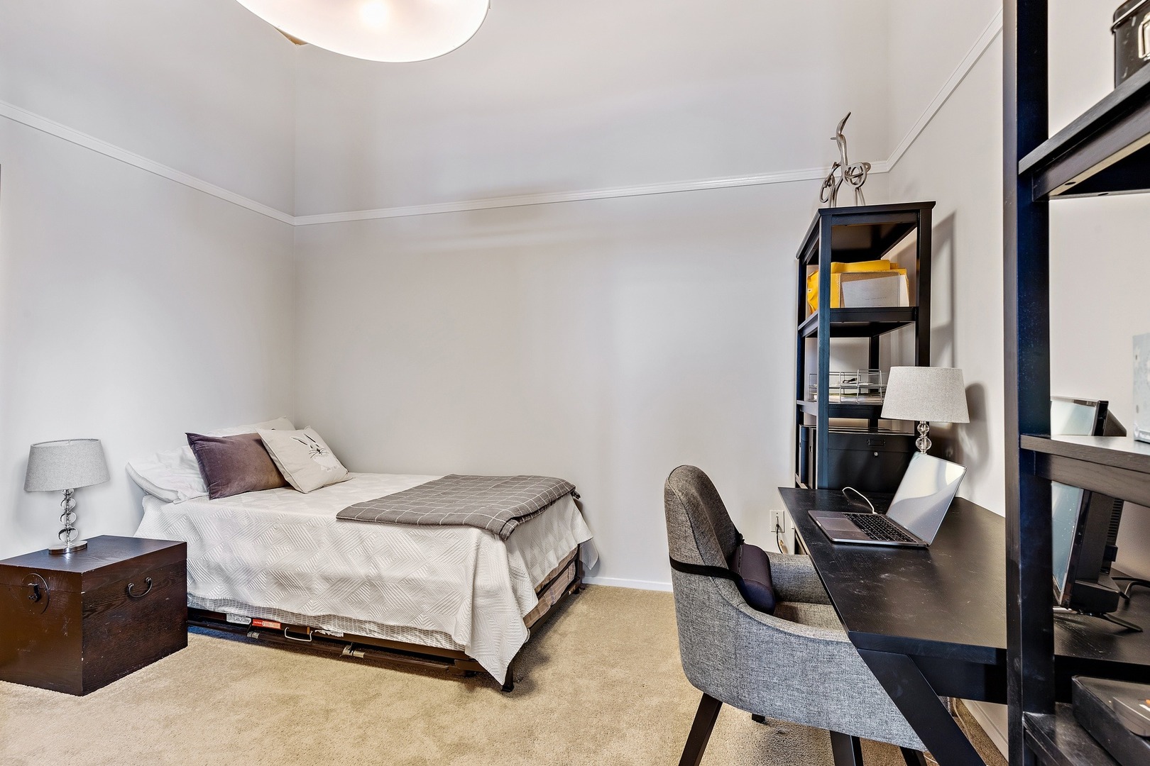 1500 West Monroe Street, Unit 401 Chicago, IL 60607 - Photo 20 of 24 a bedroom with a bed and a desk