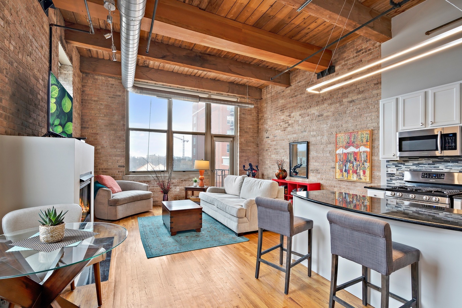 1500 West Monroe Street, Unit 401 Chicago, IL 60607 - Photo 2 of 24 a living room with furniture and a window