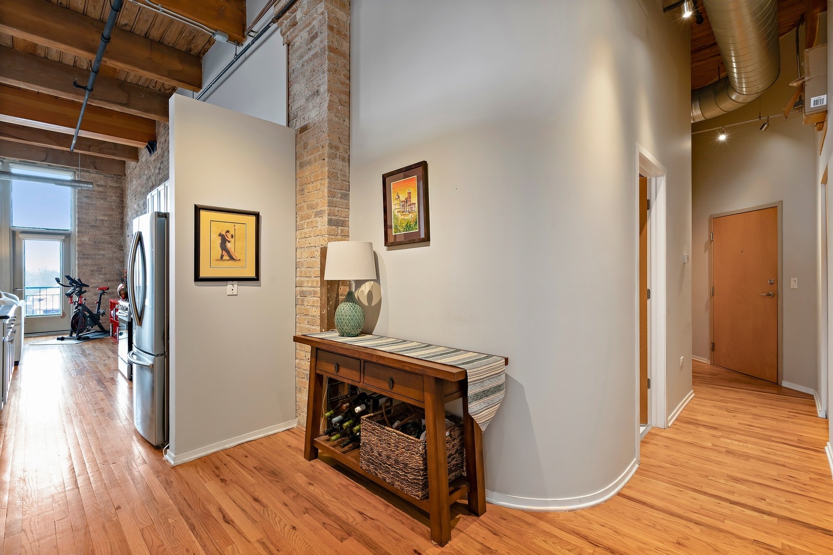 1500 West Monroe Street, Unit 401 Chicago, IL 60607 - Photo 23 of 24 a view of a livingroom with wooden floor