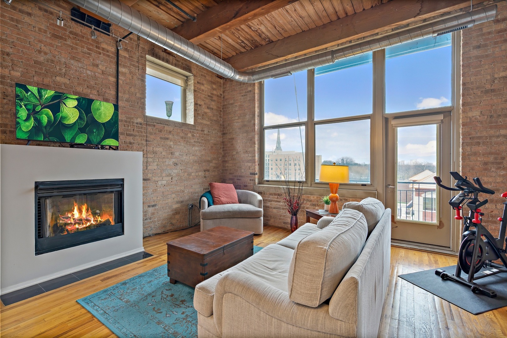 1500 West Monroe Street, Unit 401 Chicago, IL 60607 - Photo 5 of 24 a living room with furniture and a fireplace