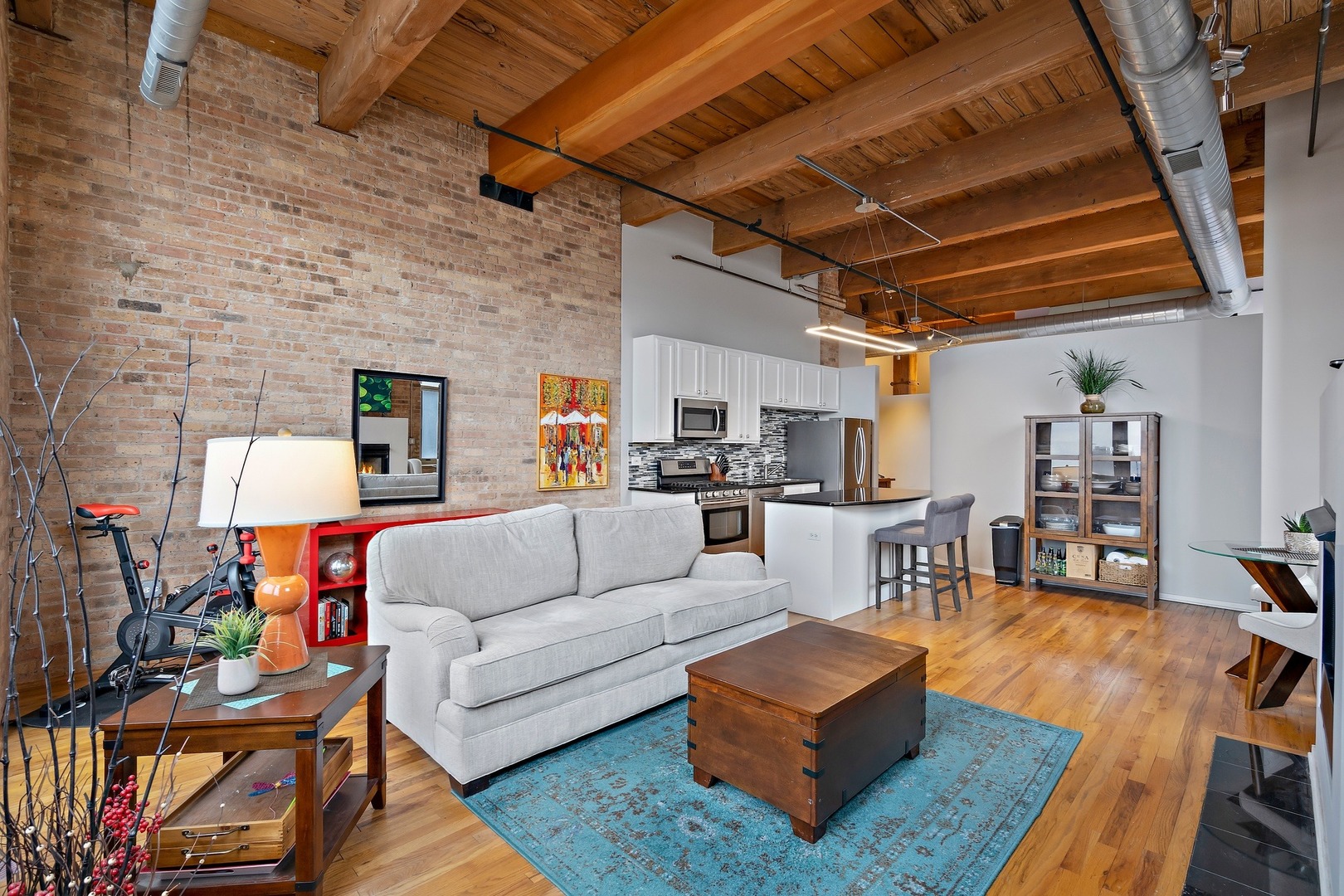 1500 West Monroe Street, Unit 401 Chicago, IL 60607 - Photo 6 of 24 a living room with furniture and a wooden floor