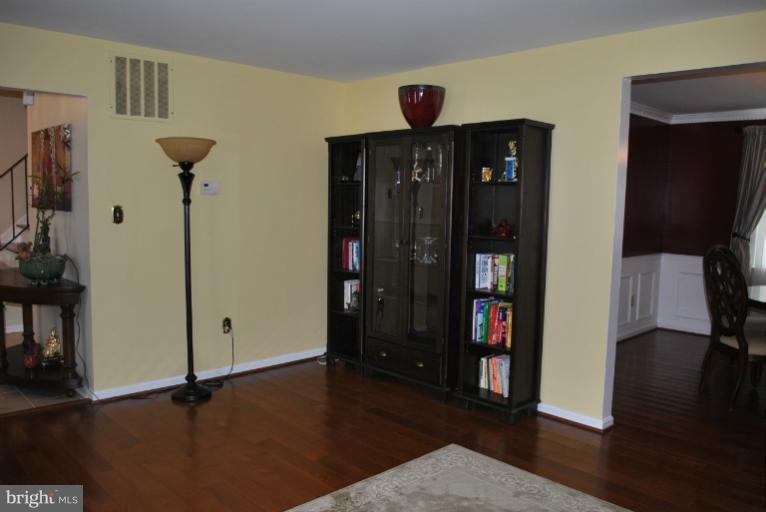 15317 Peach Orchard Road Silver Spring, MD 20905 - Photo 5 of 30 a view of a hallway with a living room