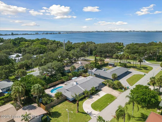 an aerial view of a house with outdoor space