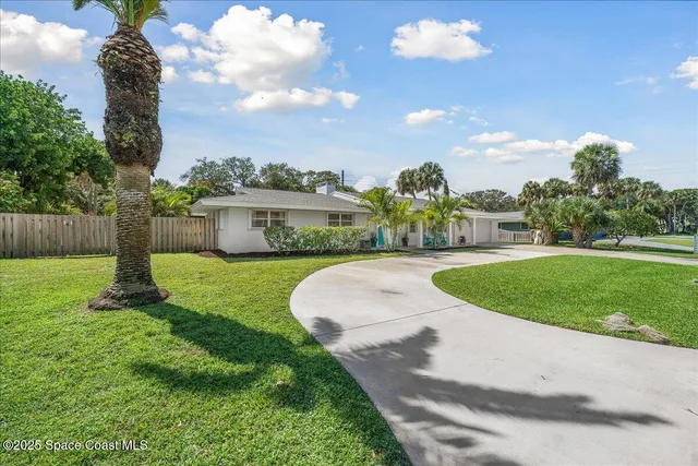 a view of a hallway with cabinet and a rug