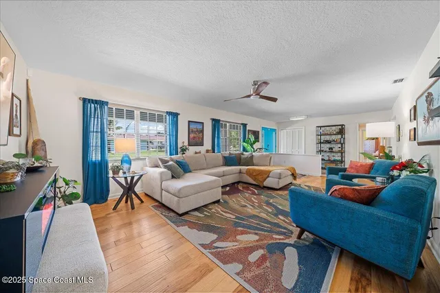 a kitchen with stainless steel appliances kitchen island granite countertop a refrigerator and microwave