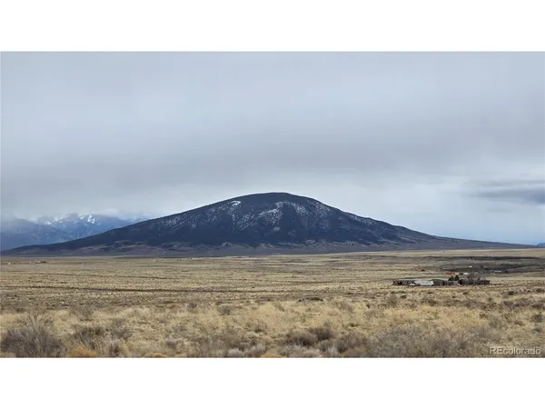 a view of an ocean beach and mountain