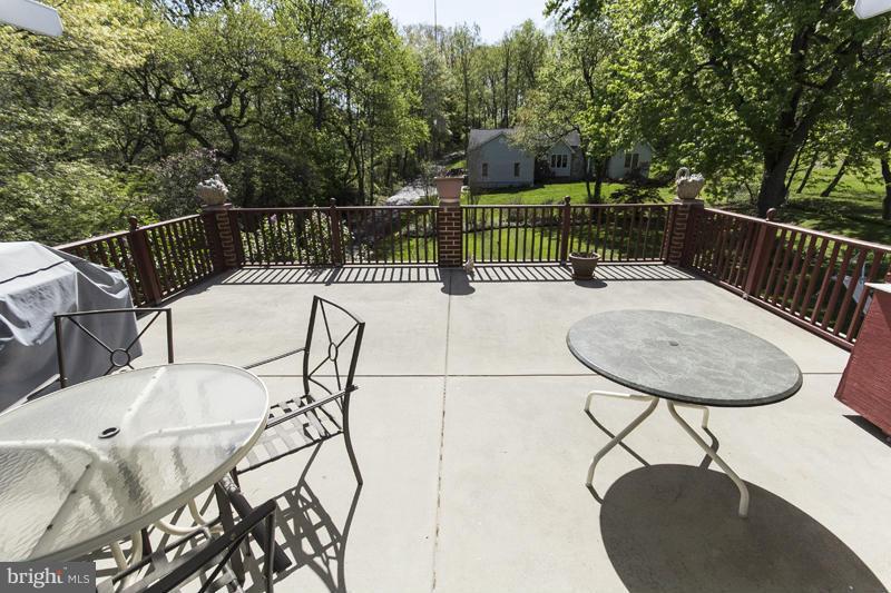 9413 Old Harford Road Baltimore, MD 21234 - Photo 29 of 30 Partially covered patio overlooking lush yard!