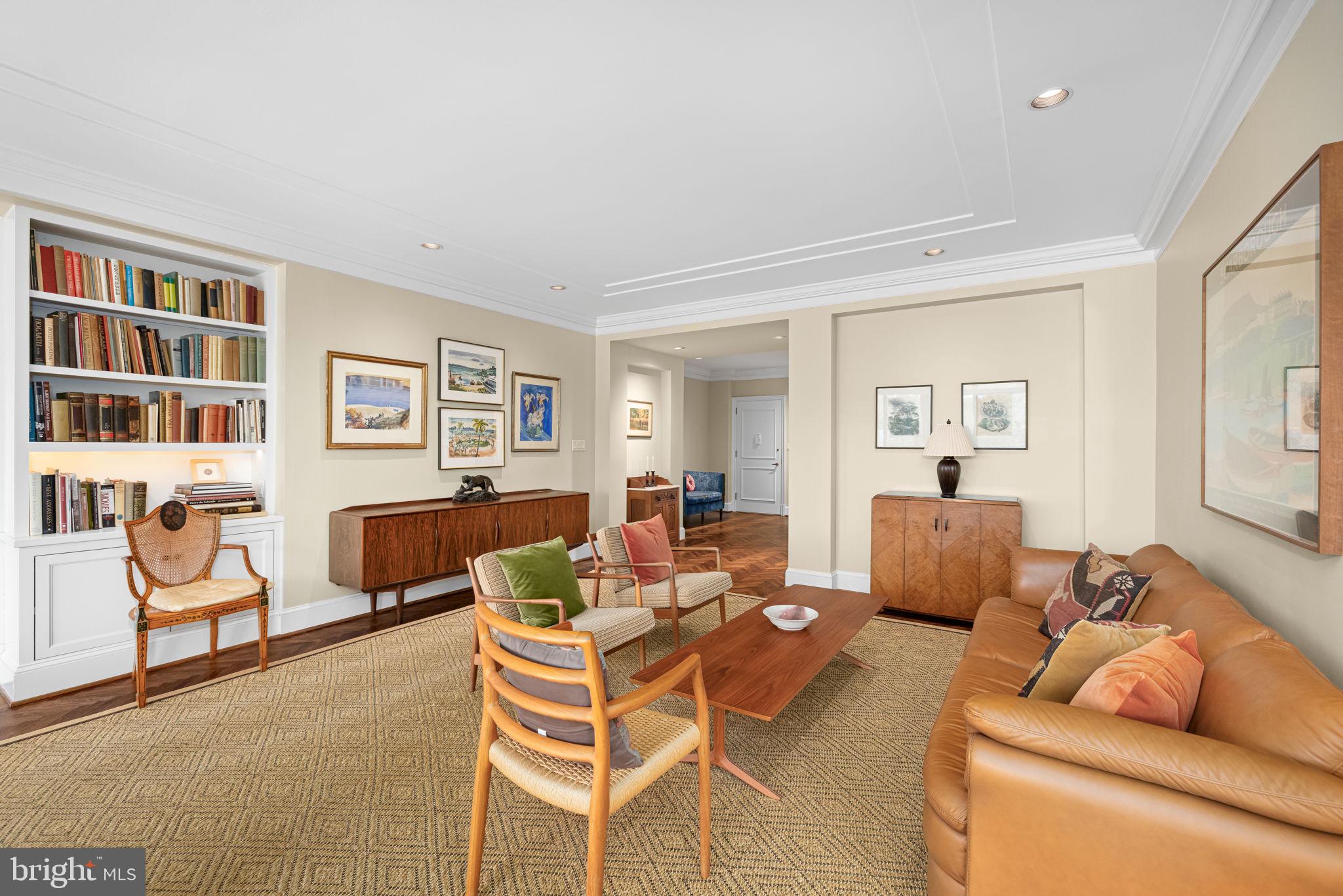 2700 Calvert Street Northwest, Unit 817 Washington, DC 20008 - Photo 13 of 64 a living room with furniture and a wooden floor