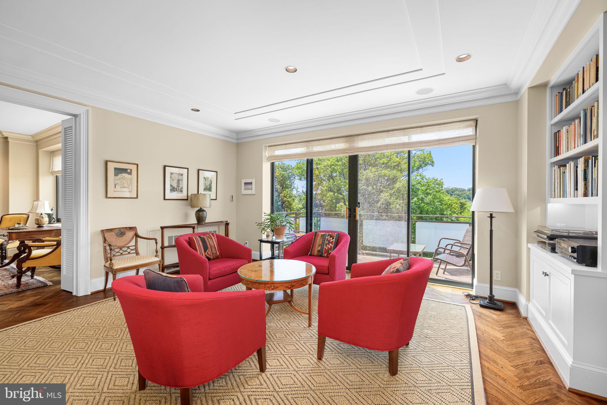 2700 Calvert Street Northwest, Unit 817 Washington, DC 20008 - Photo 16 of 64 a living room with furniture and a floor to ceiling window