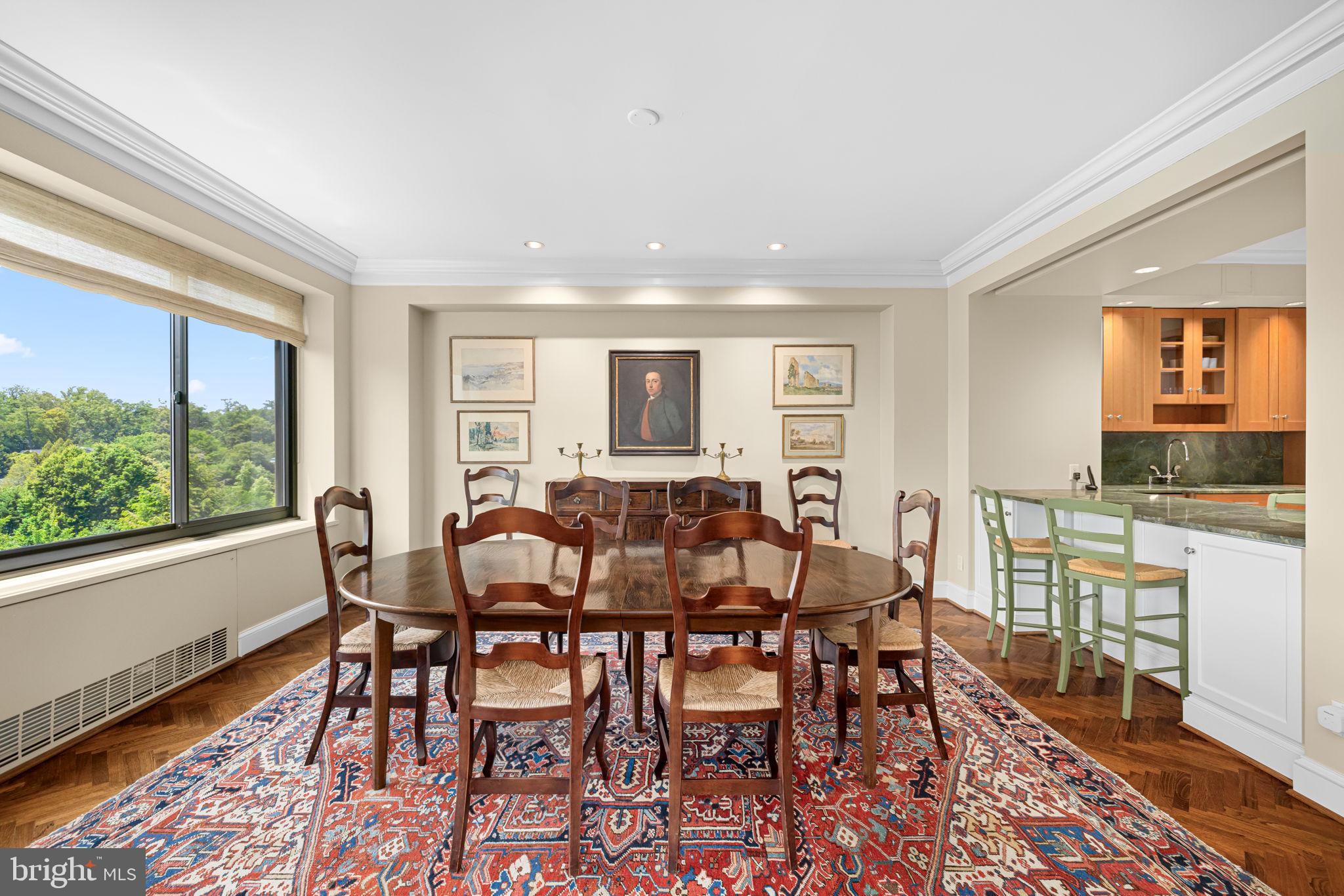 2700 Calvert Street Northwest, Unit 817 Washington, DC 20008 - Photo 17 of 64 a view of a dining room with furniture window and wooden floor