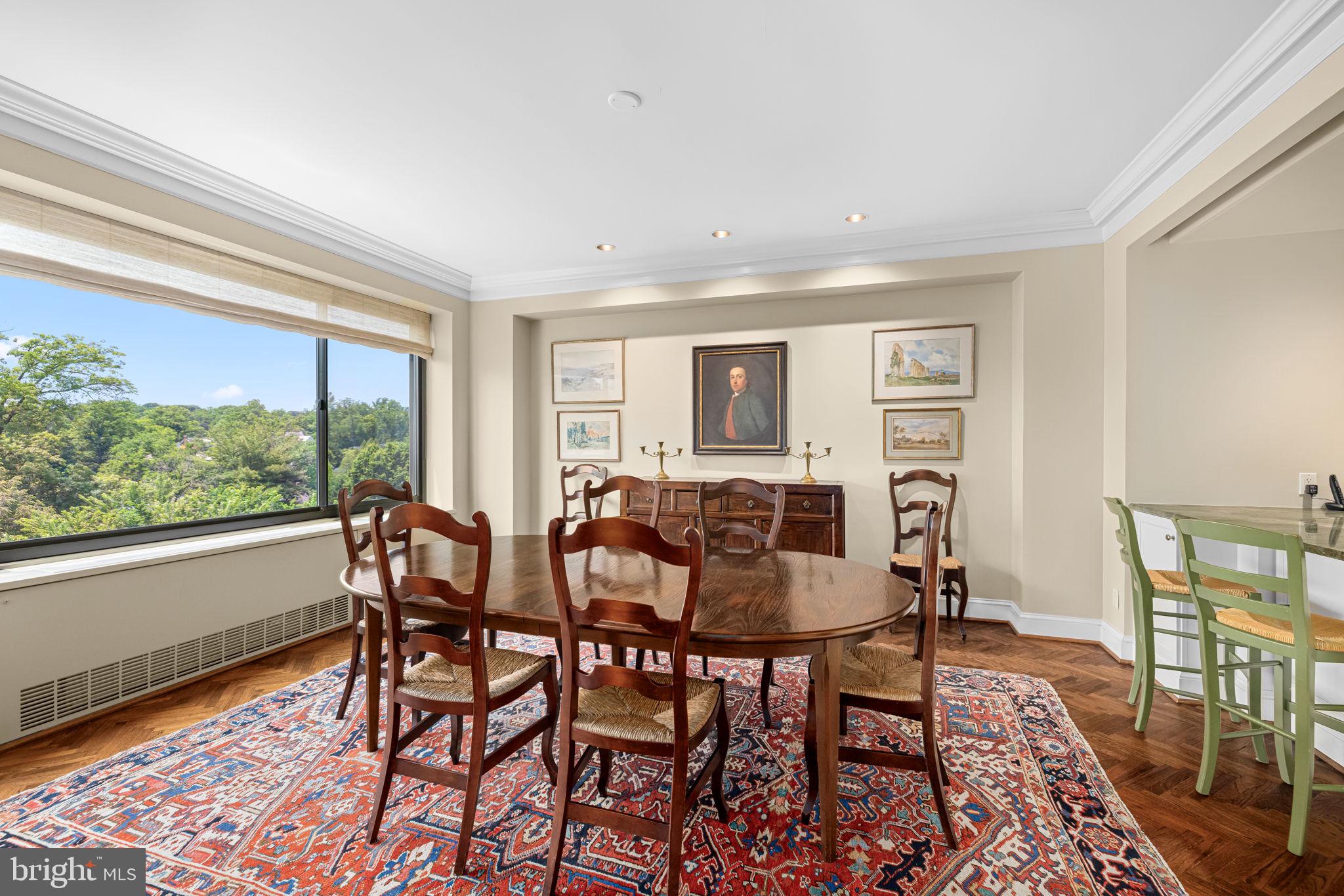 2700 Calvert Street Northwest, Unit 817 Washington, DC 20008 - Photo 18 of 64 a view of a dining room with furniture window and wooden floor