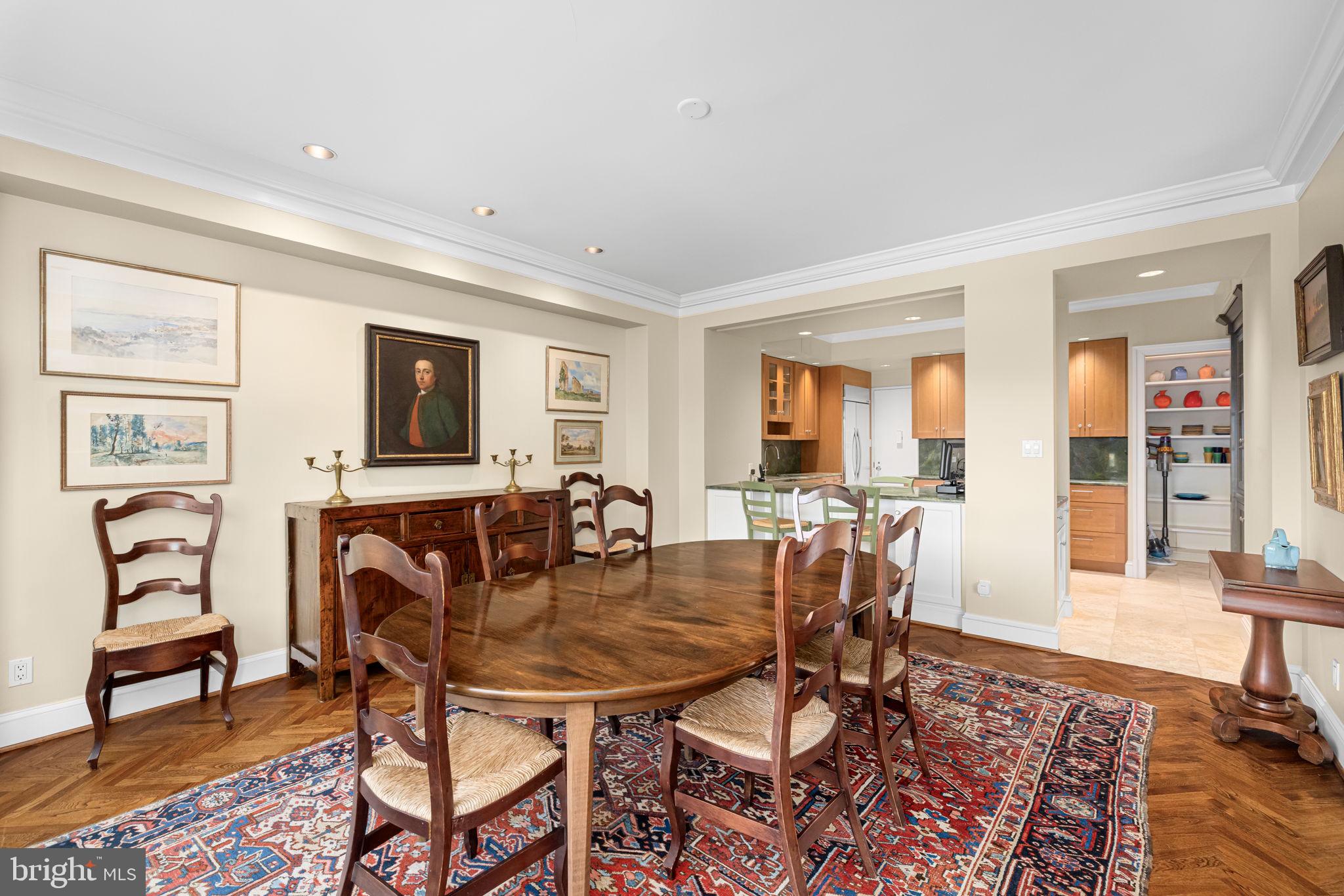 2700 Calvert Street Northwest, Unit 817 Washington, DC 20008 - Photo 19 of 64 a dining room with furniture and wooden floor