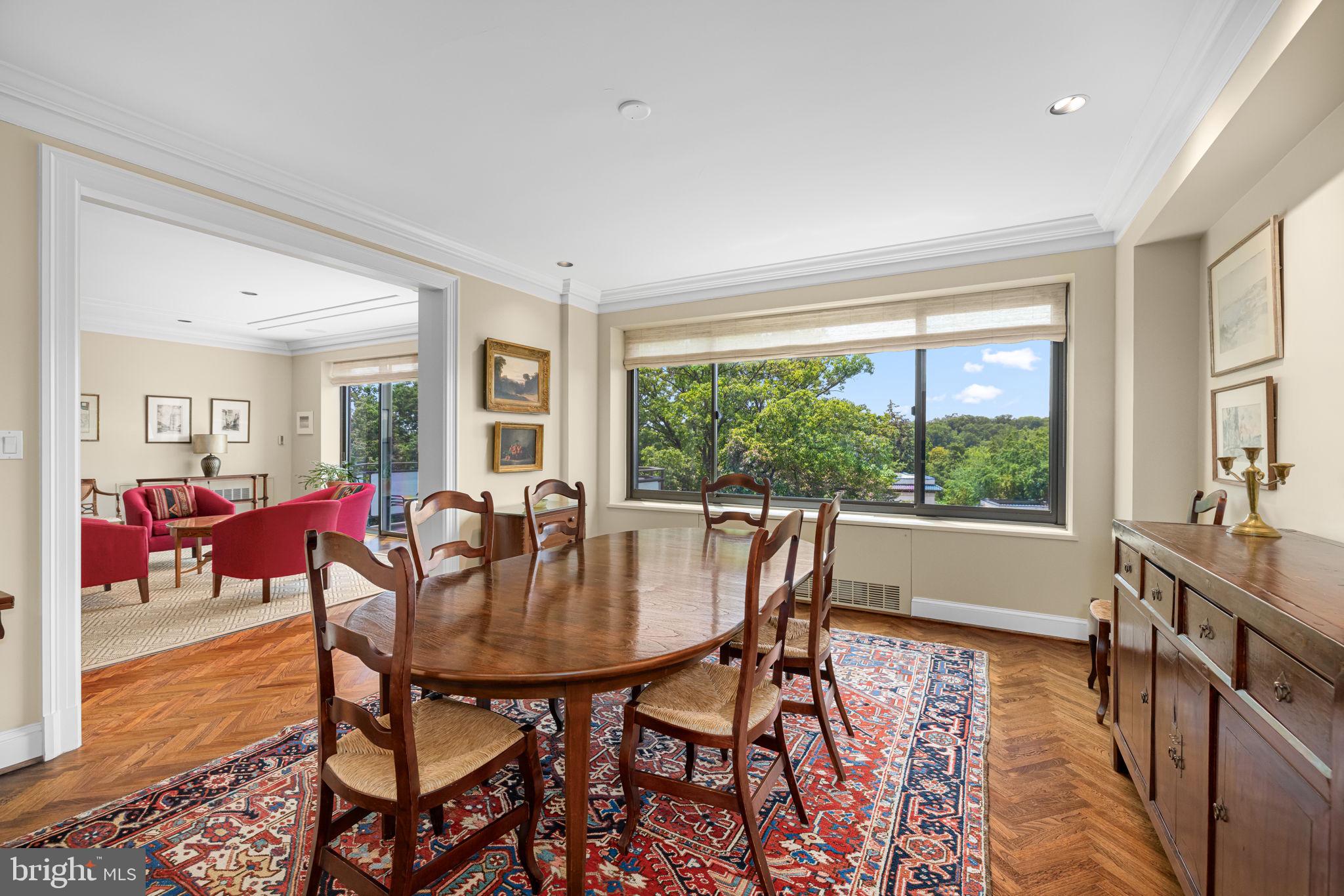 2700 Calvert Street Northwest, Unit 817 Washington, DC 20008 - Photo 21 of 64 a view of a dining room with furniture window and wooden floor