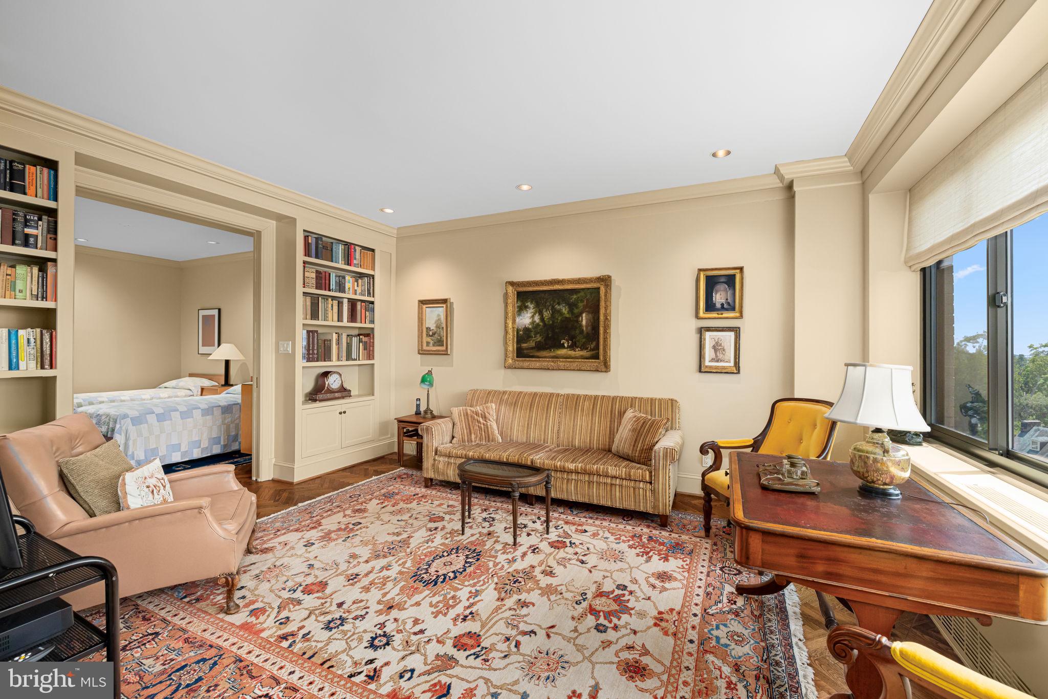 2700 Calvert Street Northwest, Unit 817 Washington, DC 20008 - Photo 29 of 64 a living room with furniture and a flat screen tv
