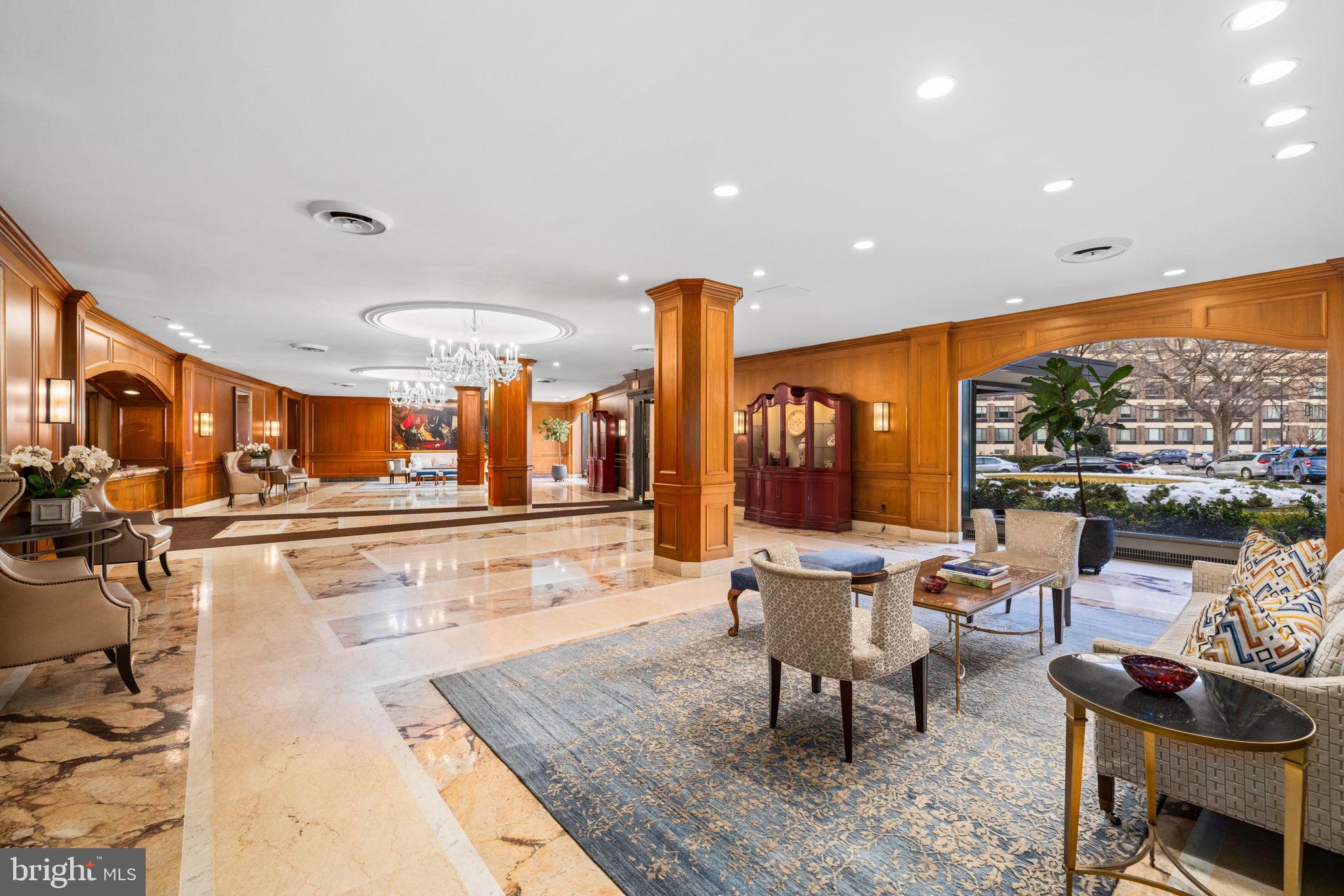 2700 Calvert Street Northwest, Unit 817 Washington, DC 20008 - Photo 3 of 64 a living room with furniture a rug and a floor to ceiling window