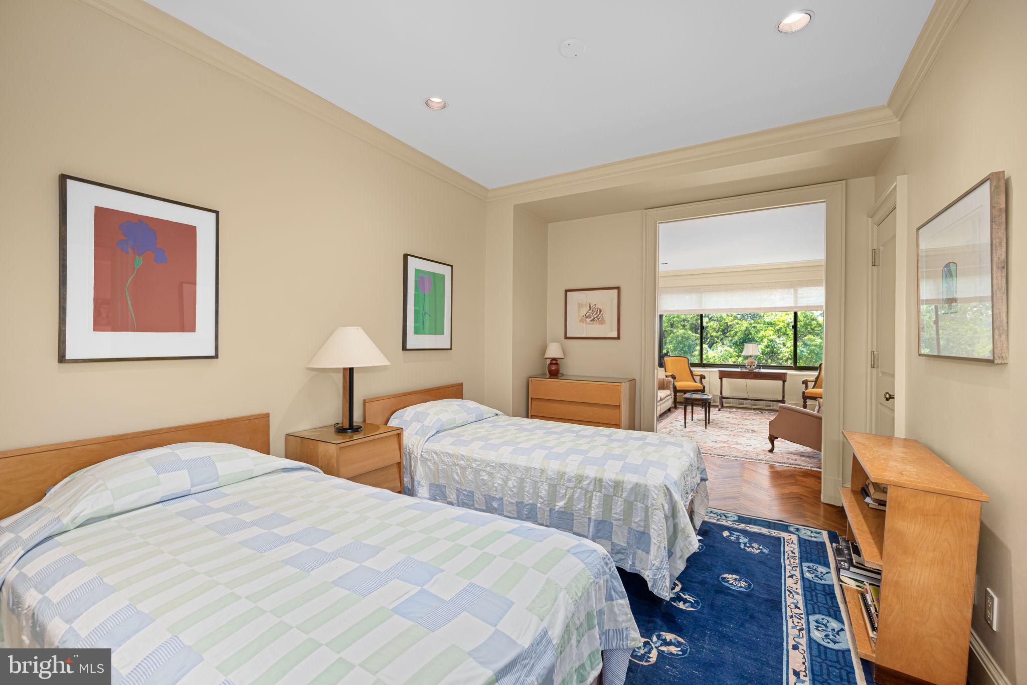 2700 Calvert Street Northwest, Unit 817 Washington, DC 20008 - Photo 33 of 64 a bedroom with two beds and a large window