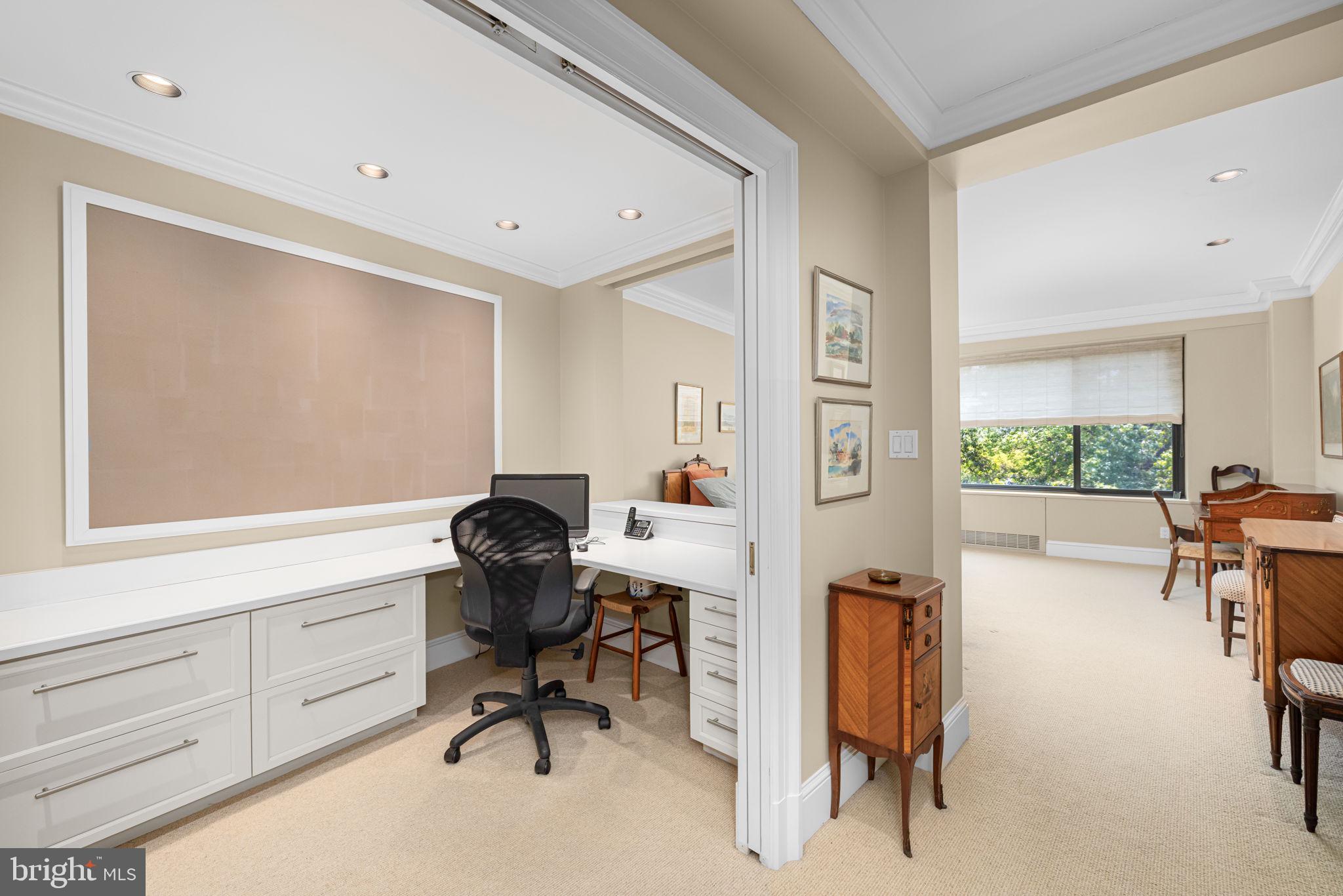 2700 Calvert Street Northwest, Unit 817 Washington, DC 20008 - Photo 37 of 64 a view of a workspace with furniture and a window