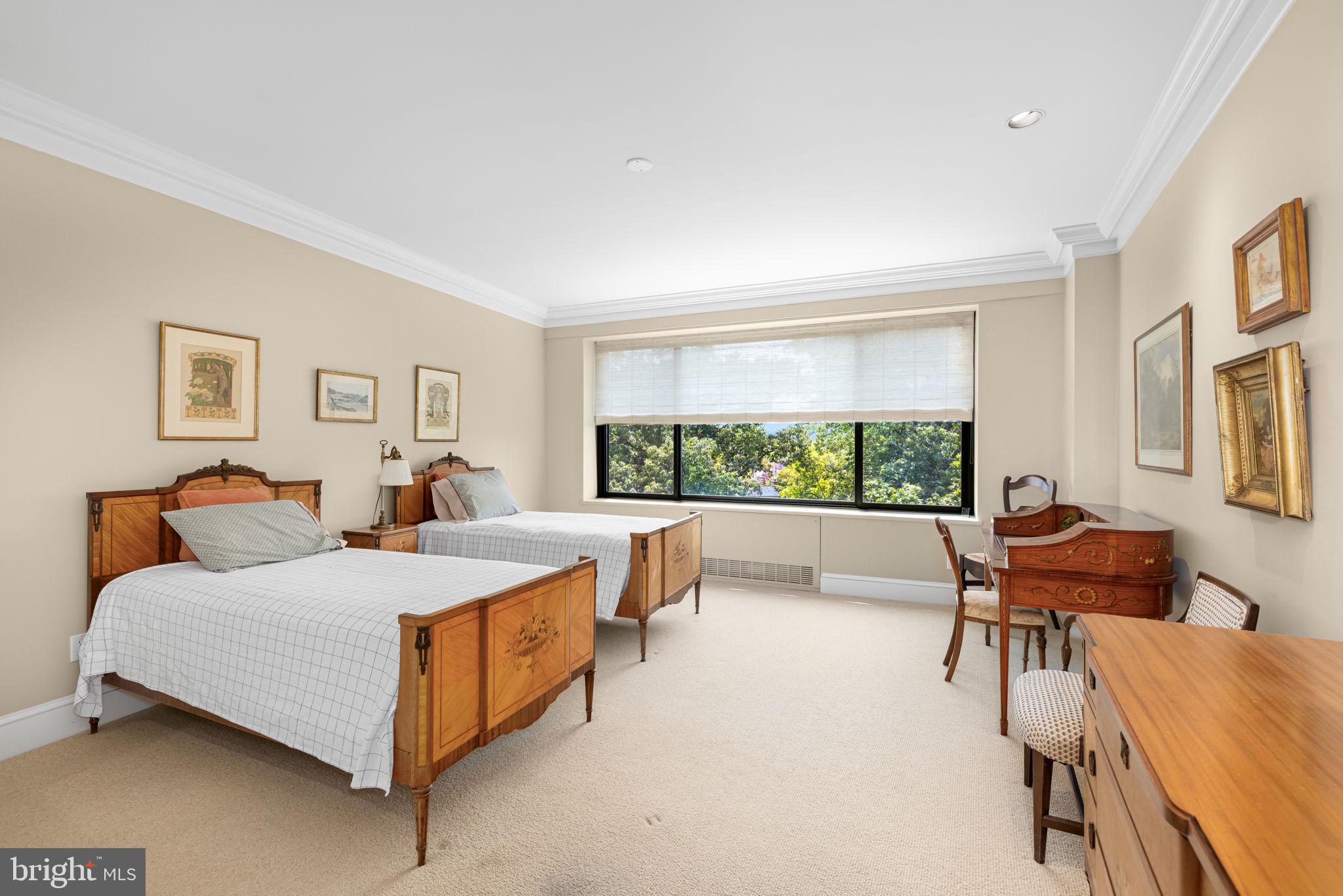 2700 Calvert Street Northwest, Unit 817 Washington, DC 20008 - Photo 40 of 64 a bedroom with a bed and a large window
