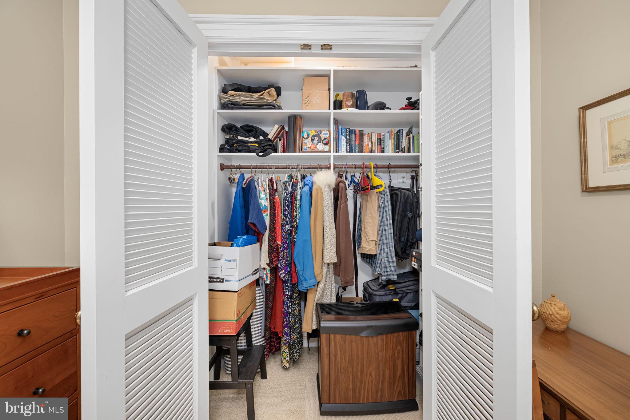 2700 Calvert Street Northwest, Unit 817 Washington, DC 20008 - Photo 48 of 64 a view of walk in closet with clothes and shoes