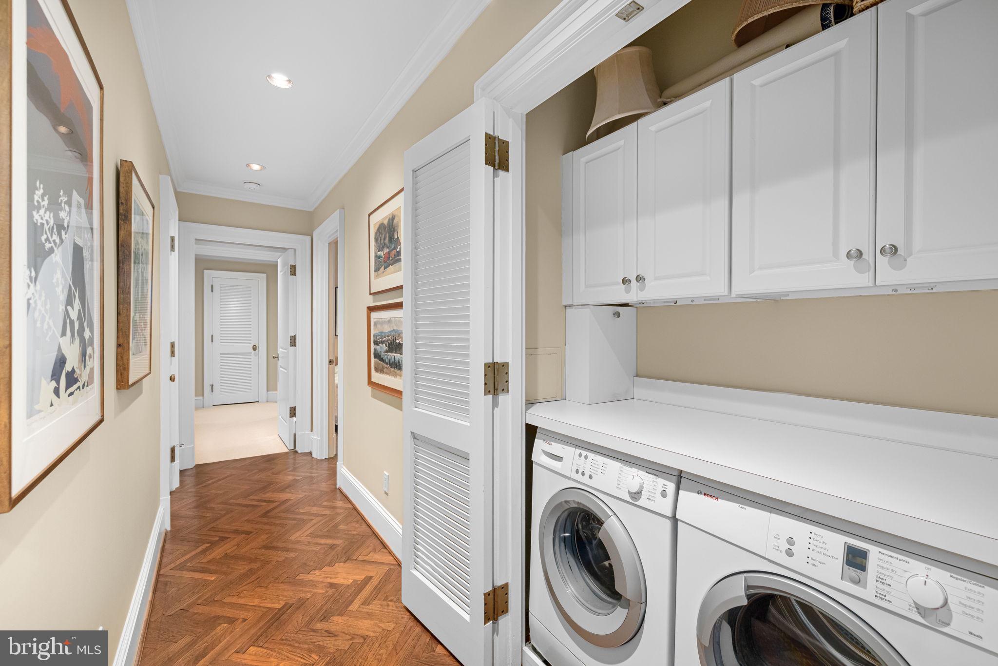 2700 Calvert Street Northwest, Unit 817 Washington, DC 20008 - Photo 49 of 64 a view of a hallway with washer and dryer