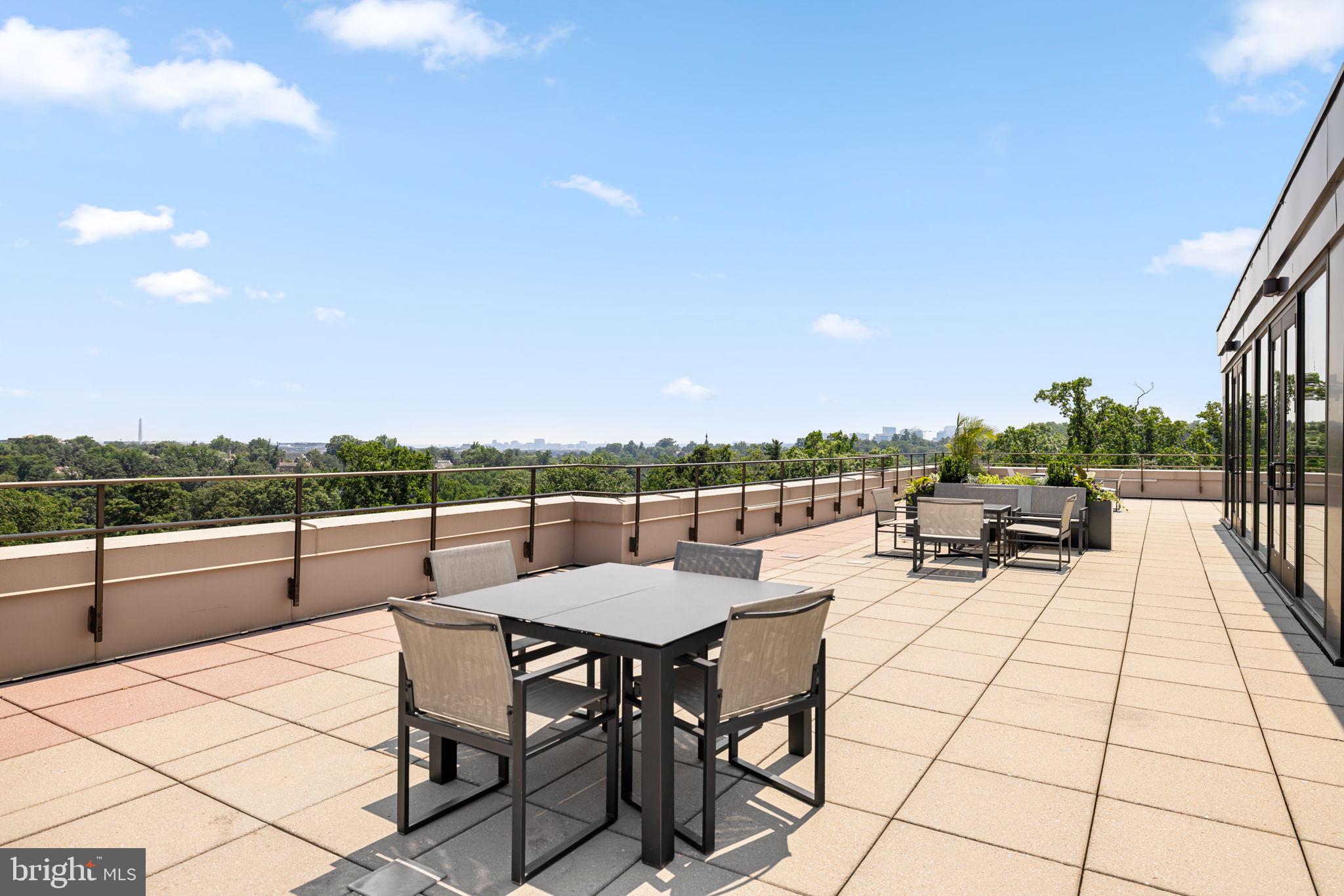 2700 Calvert Street Northwest, Unit 817 Washington, DC 20008 - Photo 55 of 64 a view of a terrace with furniture and city view