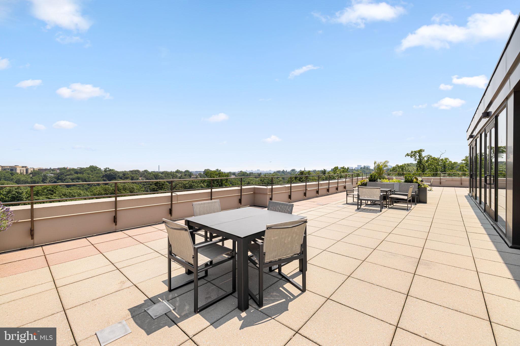 2700 Calvert Street Northwest, Unit 817 Washington, DC 20008 - Photo 59 of 64 a view of a terrace with furniture and city view