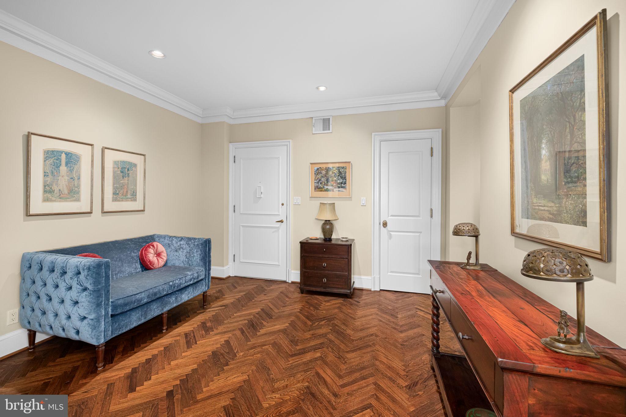 2700 Calvert Street Northwest, Unit 817 Washington, DC 20008 - Photo 6 of 64 a bedroom with a bed and wooden floor