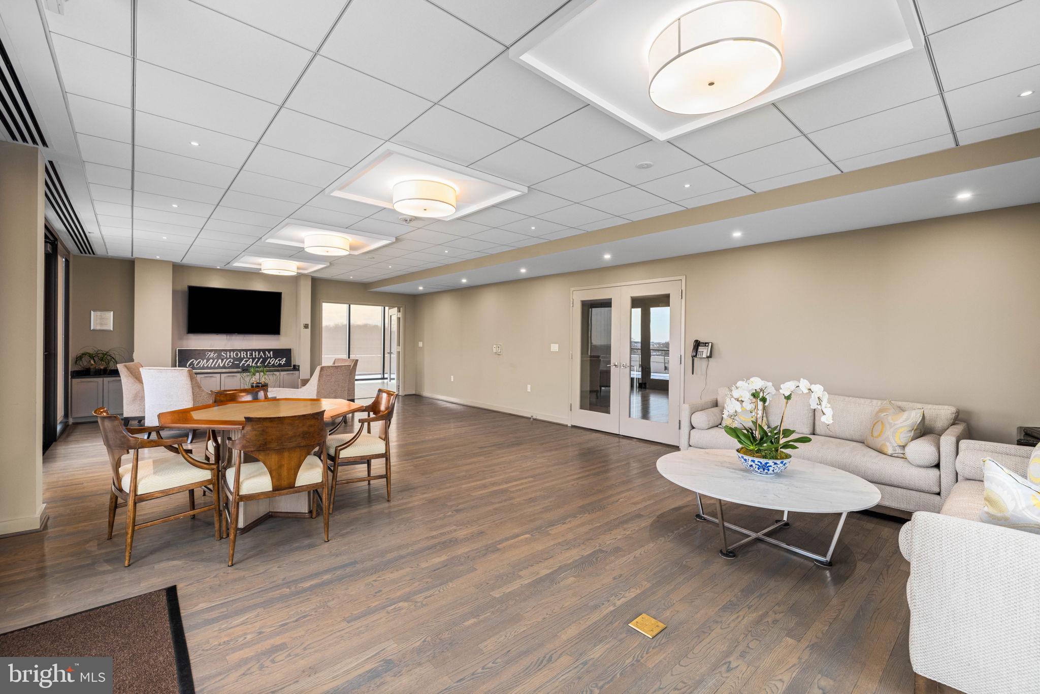 2700 Calvert Street Northwest, Unit 817 Washington, DC 20008 - Photo 64 of 64 a living room with furniture and a flat screen tv