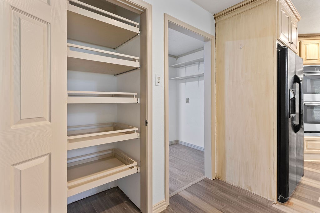 15050 Cardinal Trail Conroe, TX 77302 - Photo 13 of 44 a view of walk in closet with empty racks