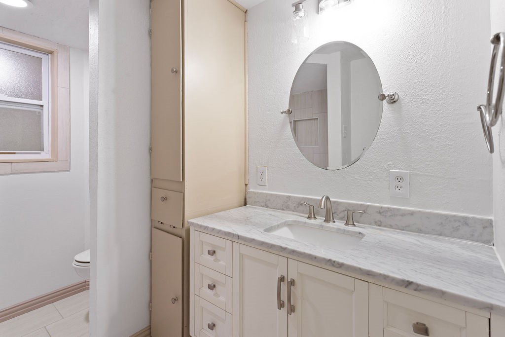 15050 Cardinal Trail Conroe, TX 77302 - Photo 16 of 44 a bathroom with a sink and a mirror