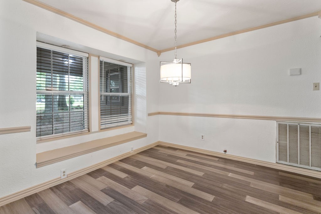 15050 Cardinal Trail Conroe, TX 77302 - Photo 20 of 44 a view of empty room with wooden floor and fan