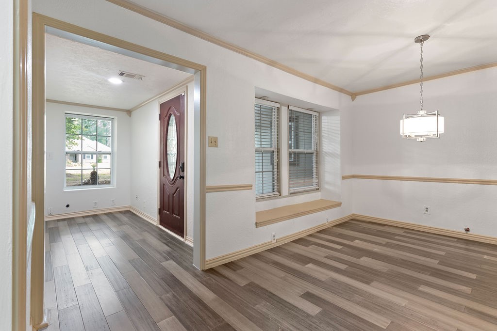 15050 Cardinal Trail Conroe, TX 77302 - Photo 33 of 44 a view of empty room with wooden floor and fan