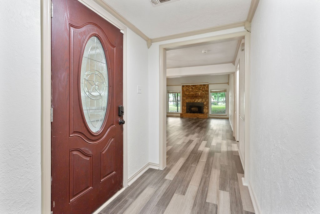 15050 Cardinal Trail Conroe, TX 77302 - Photo 34 of 44 a view of a livingroom with furniture wooden floor mirror and a shower