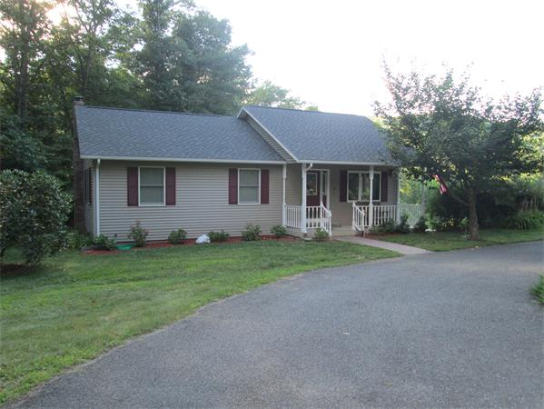2 Knightville Dam Road Huntington, MA 01050 - Photo 1 of 7 a front view of house with yard and green space