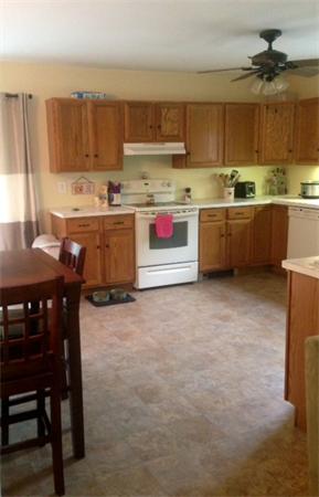 2 Knightville Dam Road Huntington, MA 01050 - Photo 3 of 7 a kitchen with a stove a sink and a refrigerator