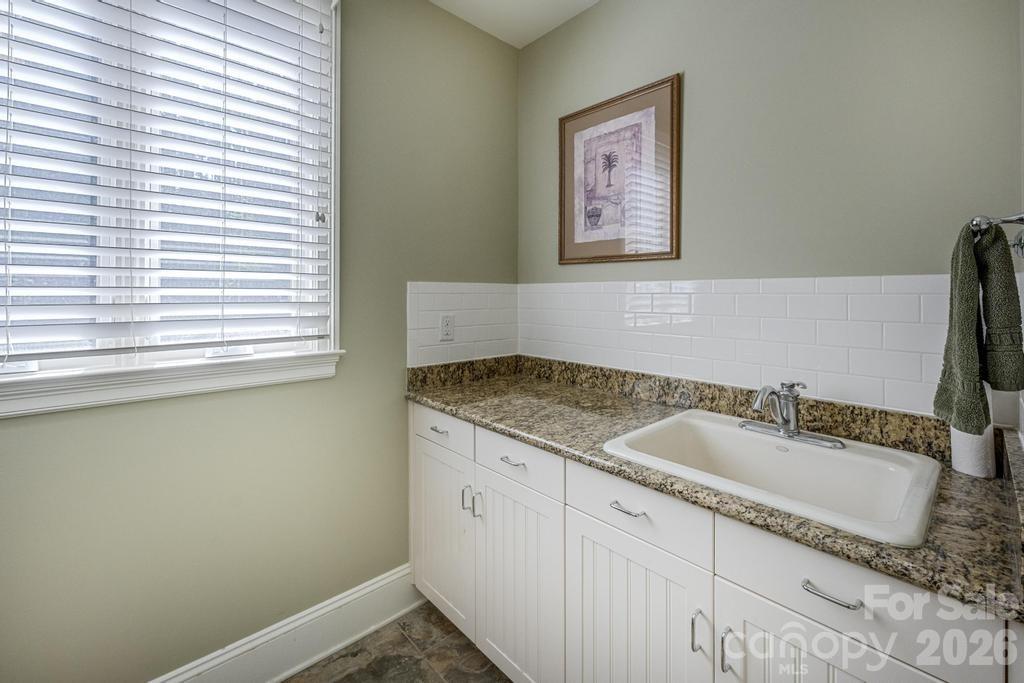 7315 Bay Ridge Drive Denver, NC 28037 - Photo 26 of 39 a bathroom with a granite countertop sink and a mirror